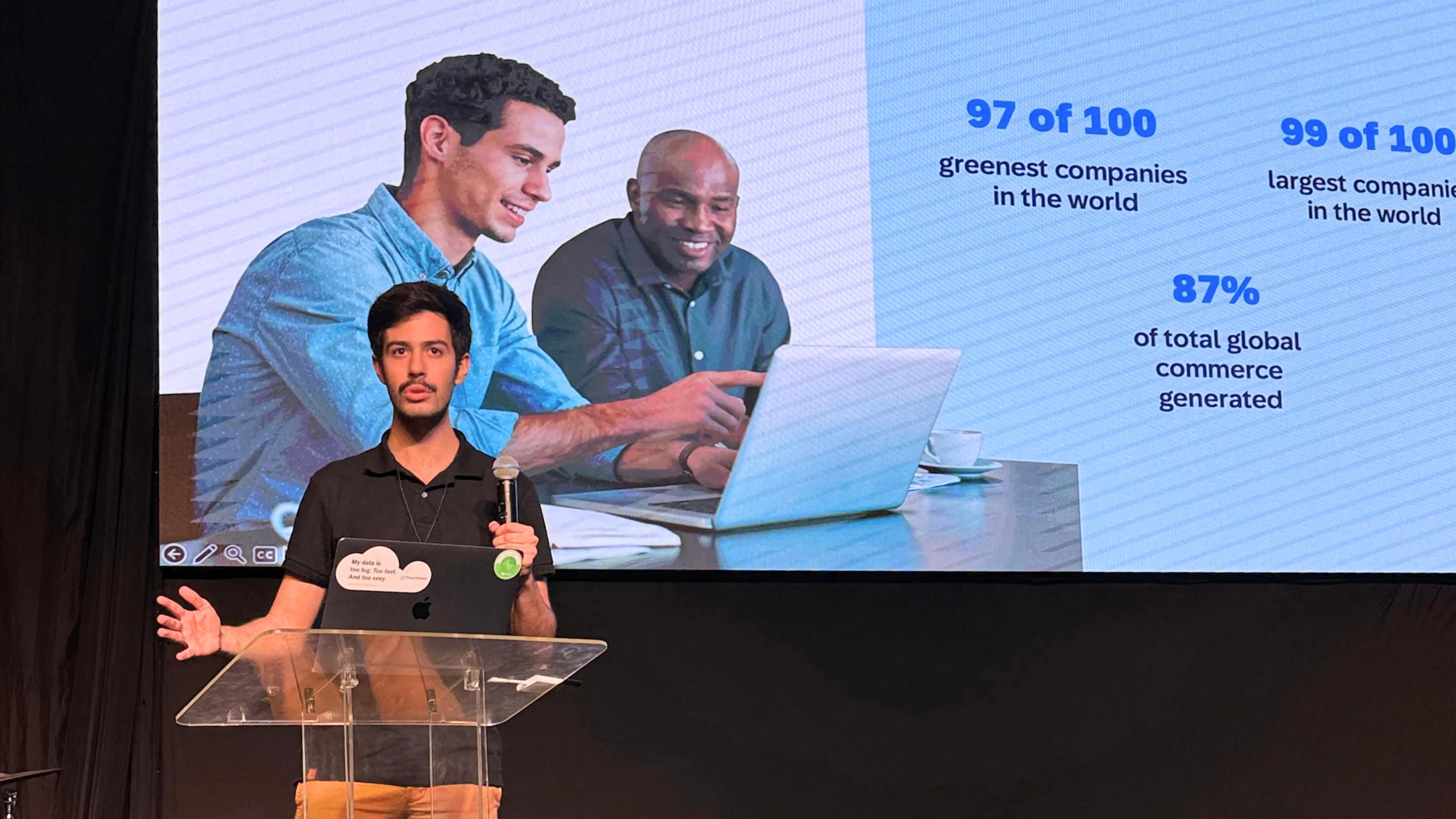 Luca presenting onstage in front of an SAP presentation screen
