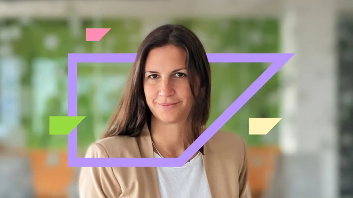 Woman with long brown hair smiling, framed by colorful geometric shapes